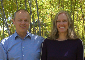 Dr. Radoslaw and Dr. Katarzyna Peliks against a green foliage of trees